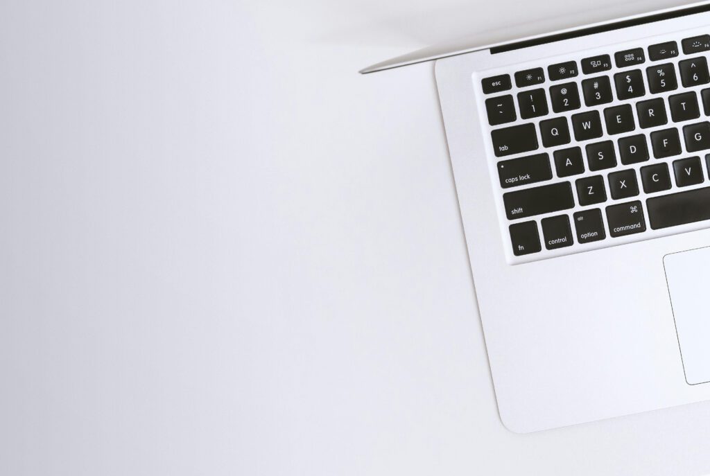 pexels-photo-238118-238118 Aerial view of a sleek laptop keyboard on a clean, white surface, ideal for tech backgrounds.